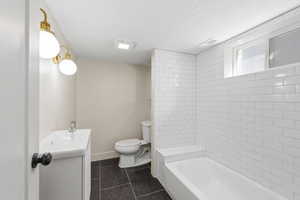 Basement bathroom with custom tile