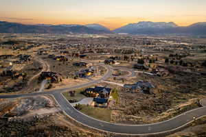 Aerial view of residential area featuring a mountainous background