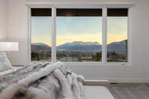 Bedroom featuring a mountain view and carpet flooring