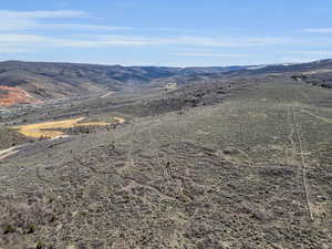 View of mountain backdrop with rural landscape and a desert landscape