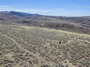 View of mountain backdrop with rural landscape