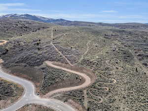 View of rural area featuring a mountainous background and a desert landscape