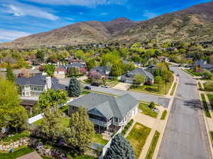 Aerial view of residential area featuring mountains