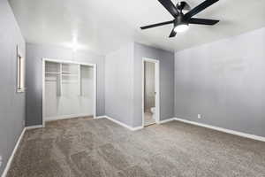Unfurnished bedroom with a closet, carpet flooring, and a ceiling fan