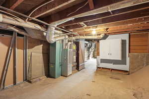 Unfinished basement with strapped water heater and heating unit