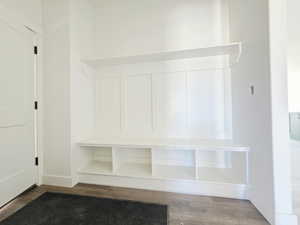 Mudroom with dark wood finished floors