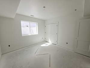 Unfurnished bedroom with baseboards and a closet