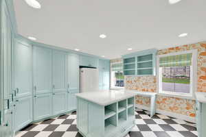 Huge laundry / craft room with second refrigerator