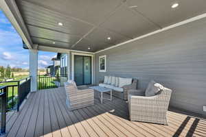 Wooden deck with an outdoor lounge area