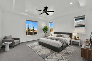 Bedroom featuring a wood tray ceiling, a ceiling fan, carpet, and recessed lighting