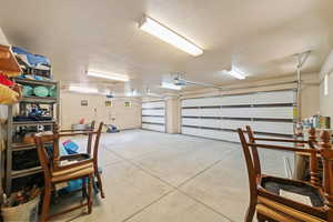 Garage featuring a garage door opener