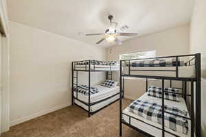 Bedroom with carpet floors and a ceiling fan