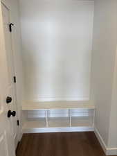 Mudroom featuring dark wood-style flooring