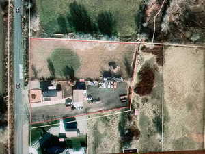 Aerial view of sparsely populated area with property boundaries highlighted