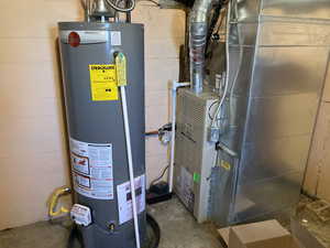 Utilities featuring gas water heater and heating unit
