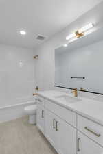 Full bath featuring vanity, bathing tub / shower combination, light tile patterned flooring, and recessed lighting