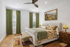 Master bedroom featuring crown molding, and double closets