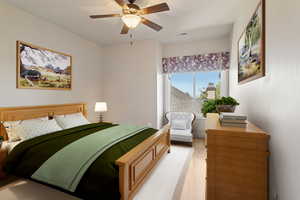 Bedroom featuring hardwood flooring and a ceiling fan
