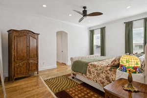 Master bedroom featuring crown molding, and double closets
