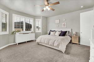 Bedroom with carpet and a ceiling fan
