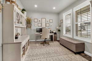 Home office with baseboards and recessed lighting