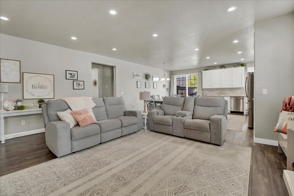 Living room featuring recessed lighting and light wood-type flooring