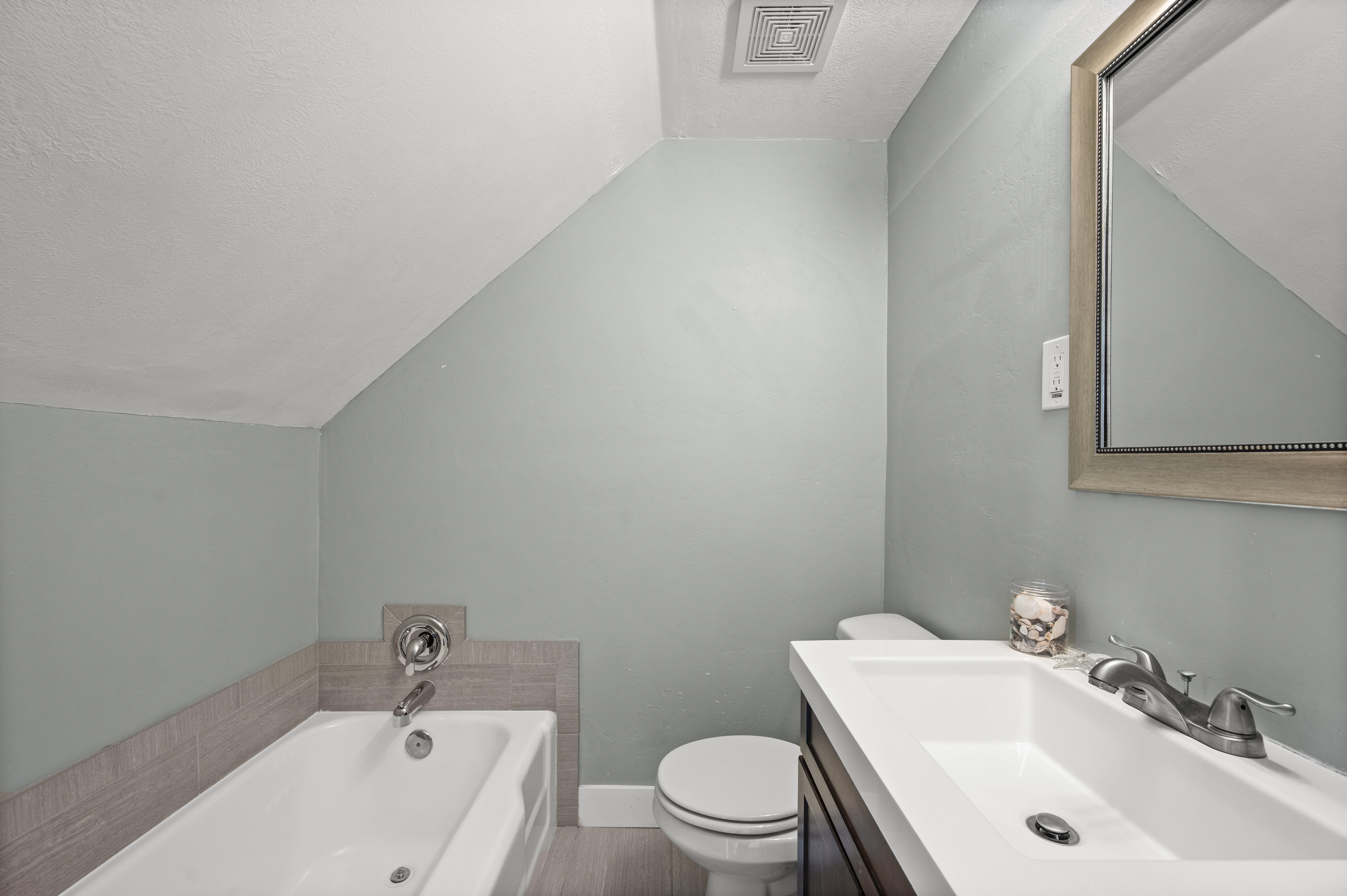 Full bath featuring a bath and vanity