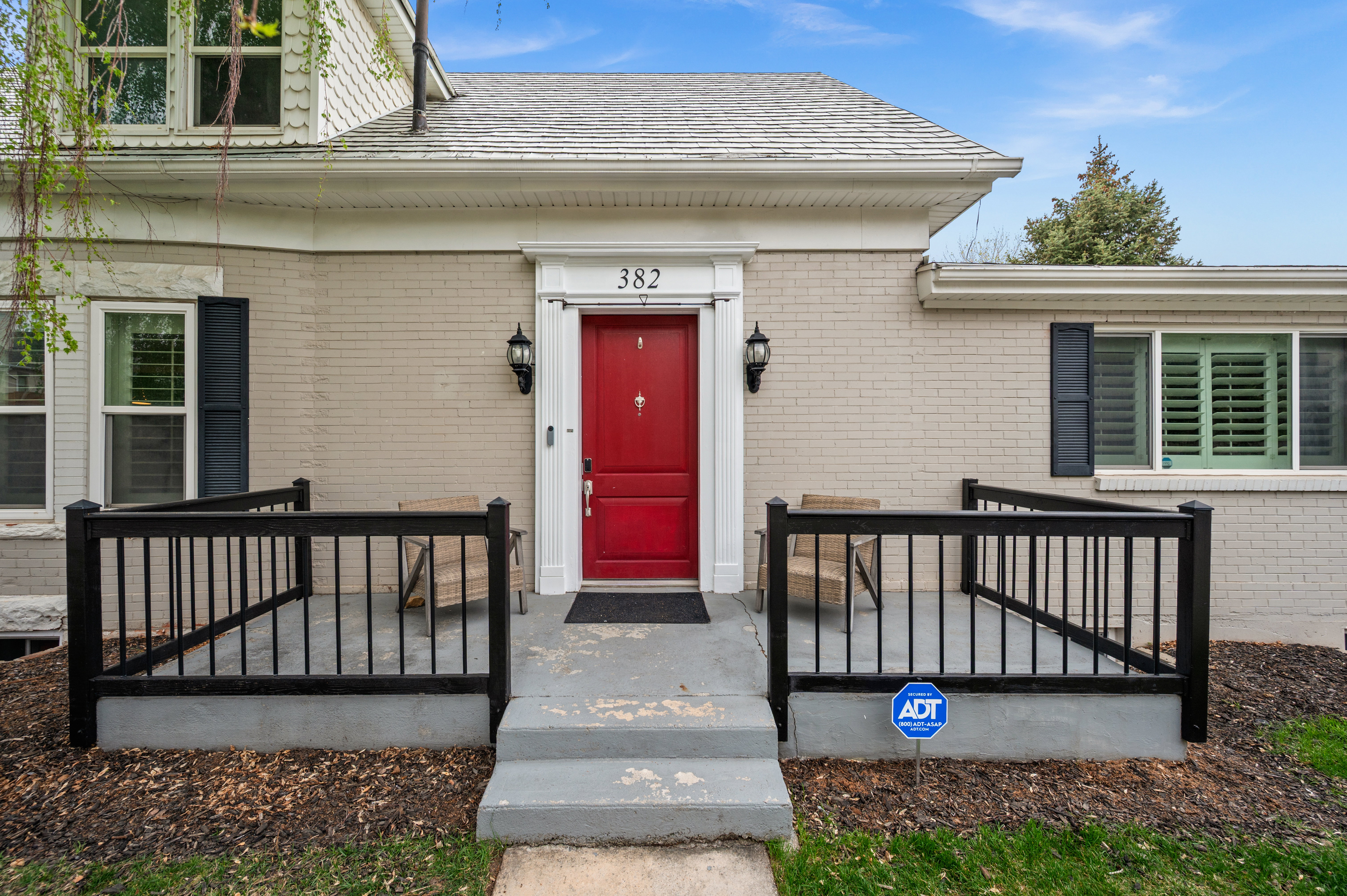 Doorway to property with brick siding