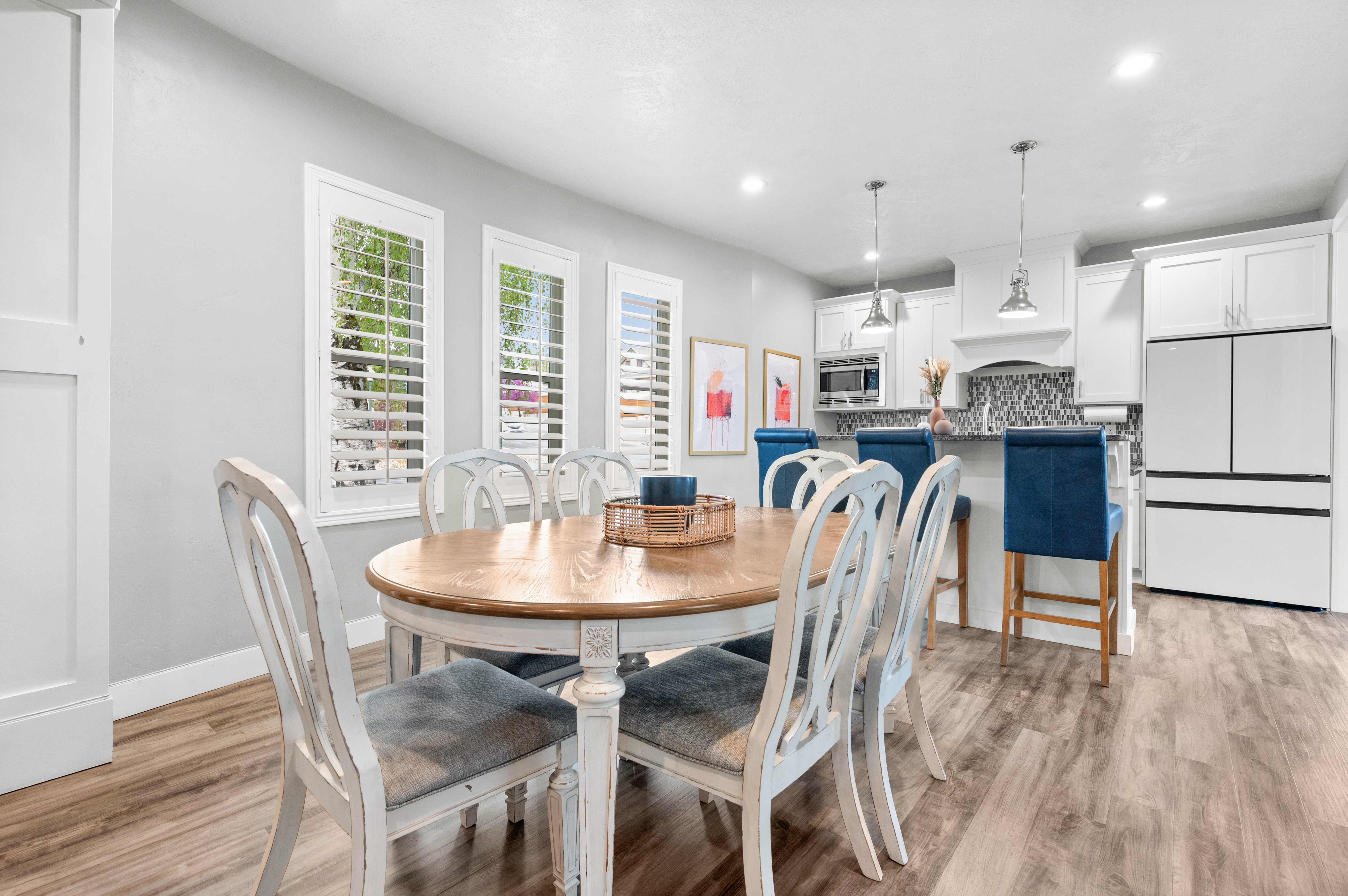 Dining space with light wood-type flooring and recessed lighting