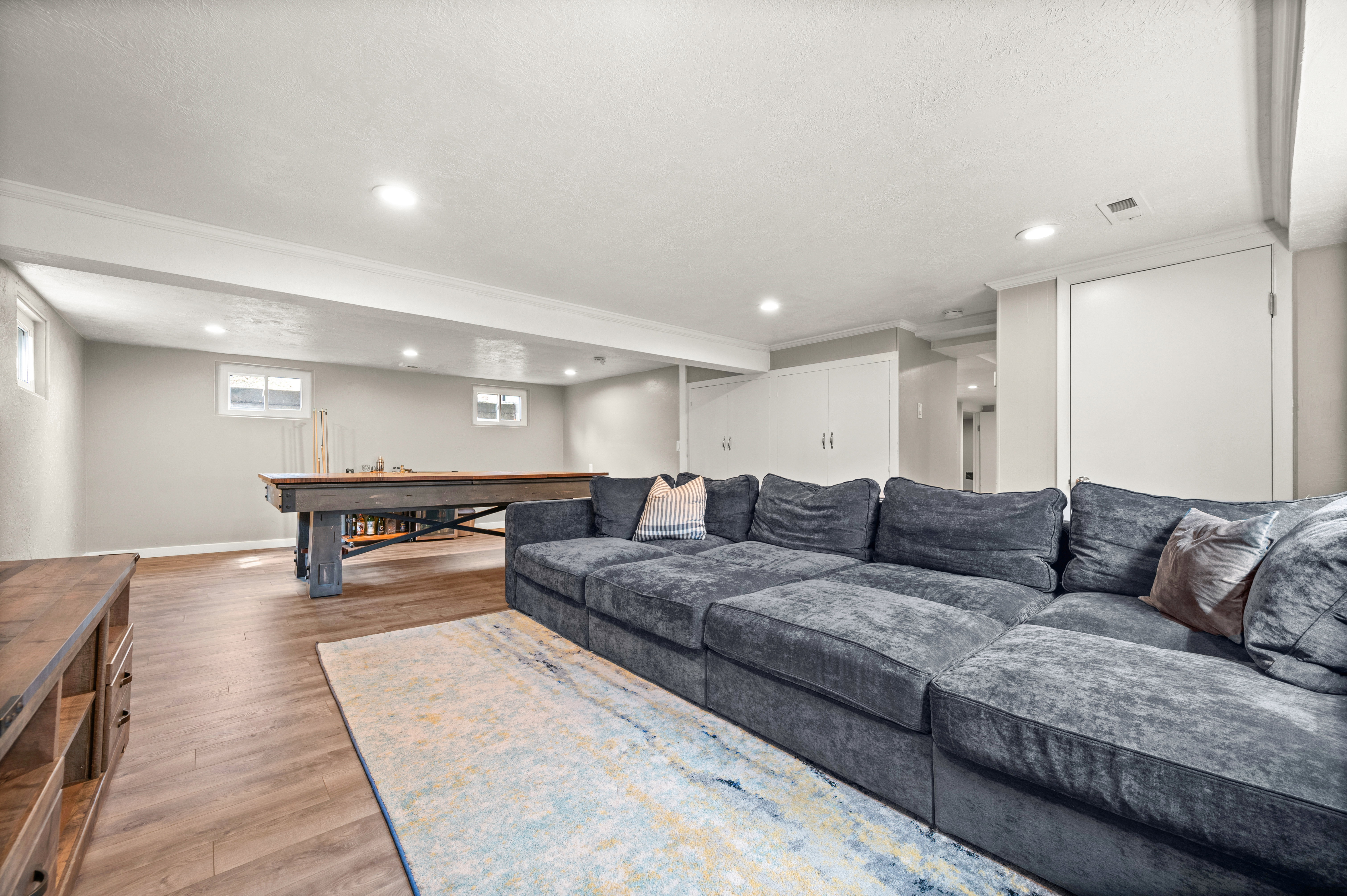 Living room featuring light wood-style floors and recessed lighting