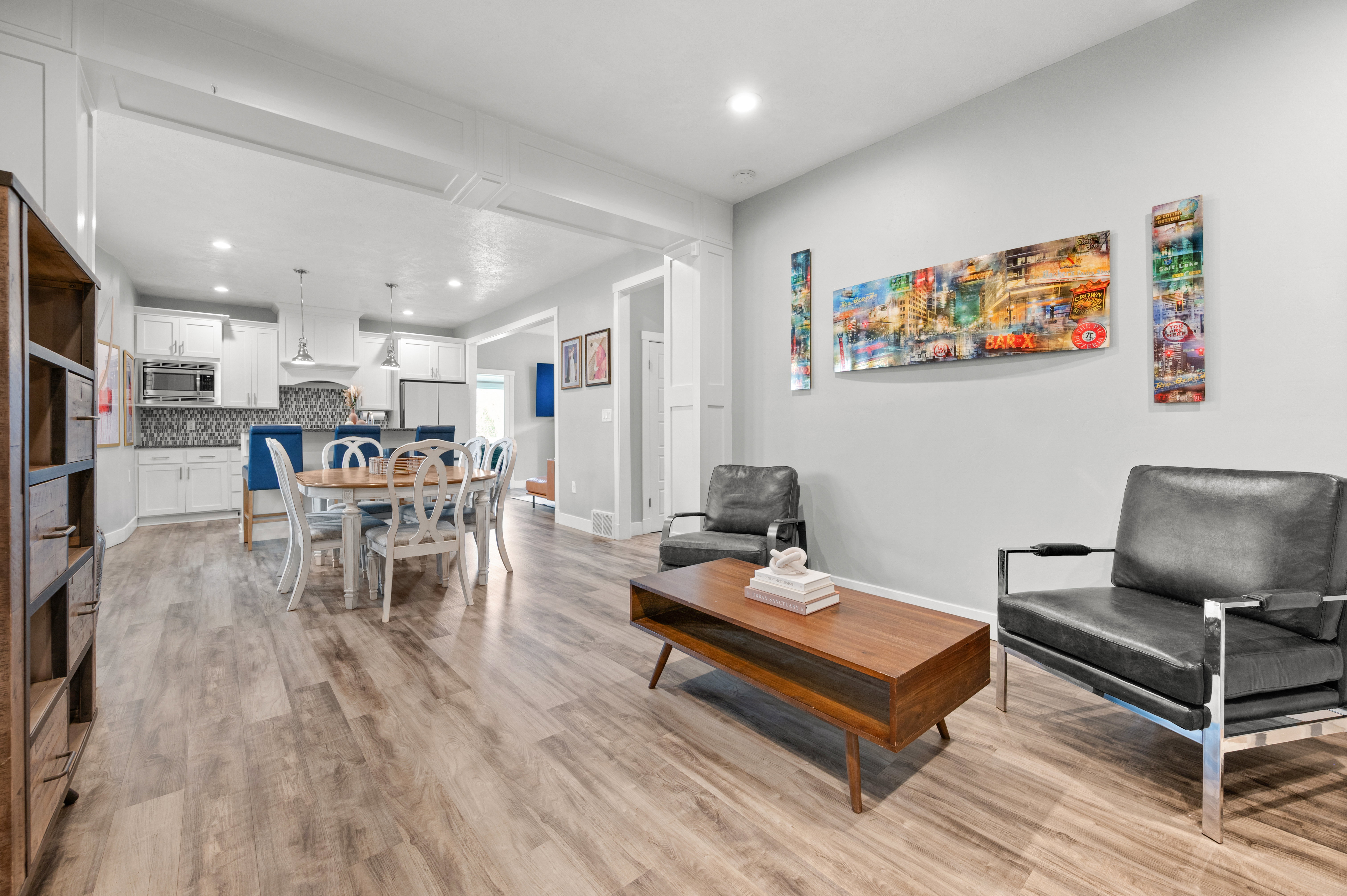 Living area featuring light wood-style flooring and recessed lighting