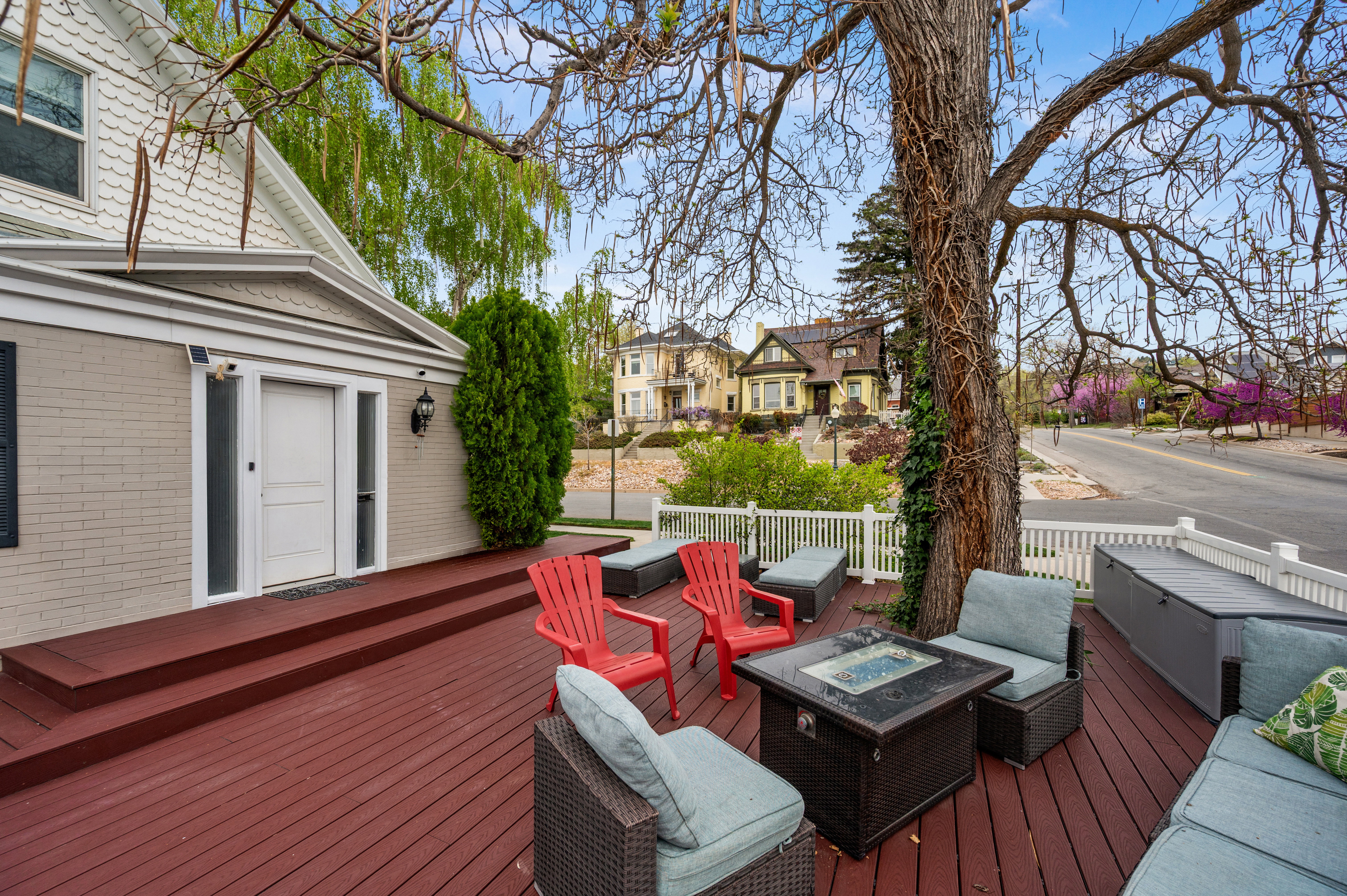 Deck featuring an outdoor living space with a fire pit and a residential view