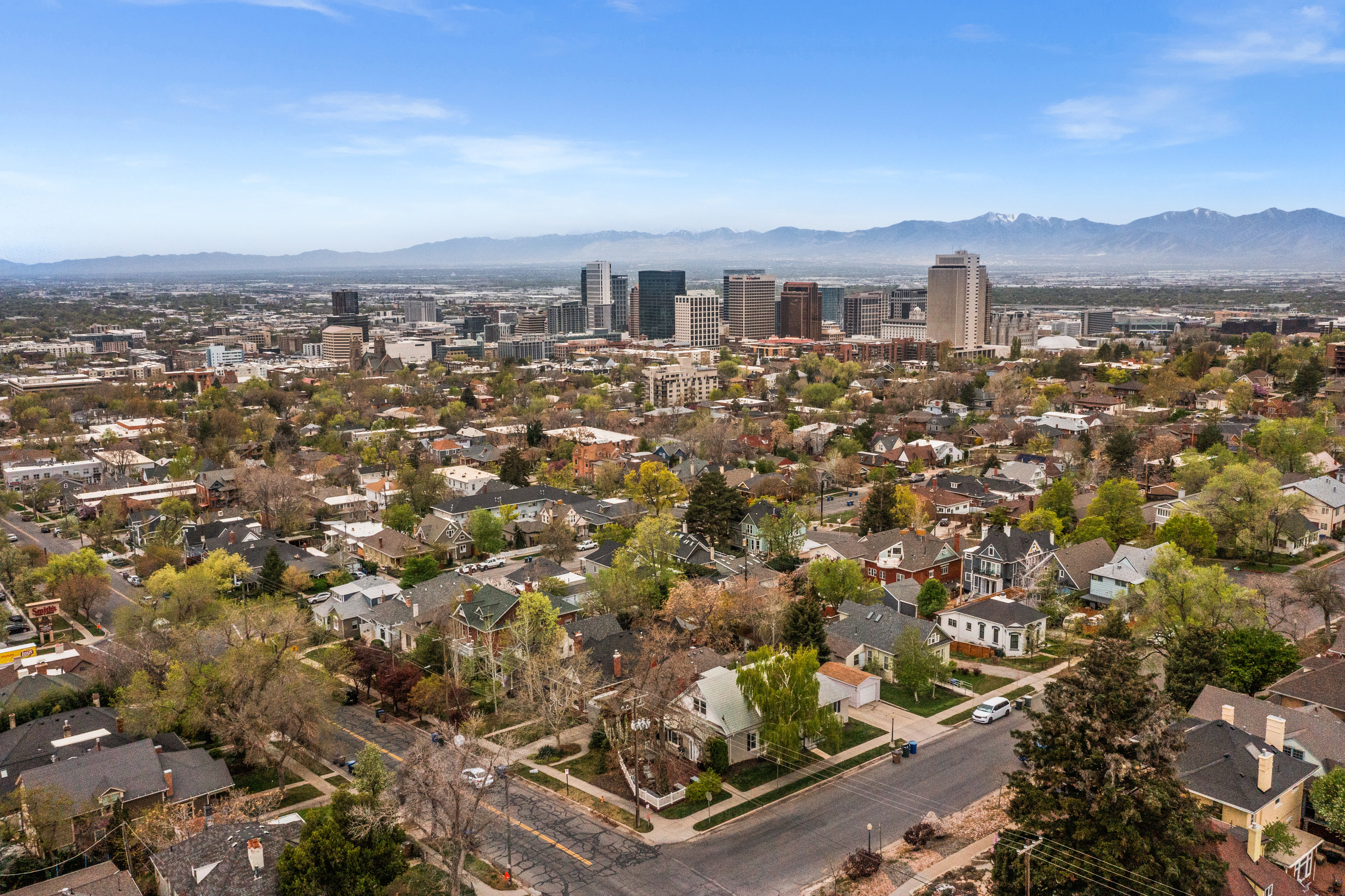 View of urban area with a mountain backdrop and nearby suburban area