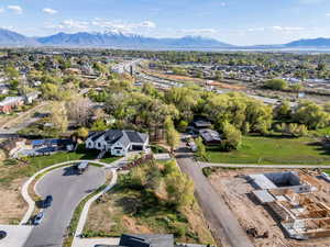 Aerial perspective of suburban area featuring a mountainous background