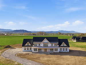 Rear view of house featuring a view of countryside and a mountain view