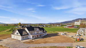 Aerial view of sparsely populated area featuring a mountainous background