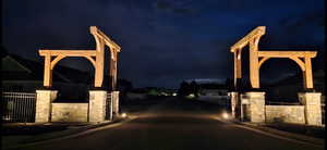 Exterior space with a gate, a gated entry, and curbs