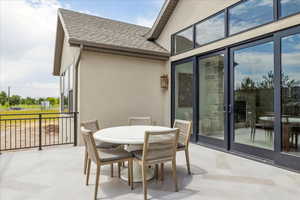 View of patio with outdoor dining area