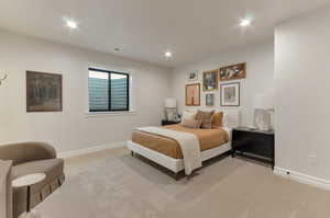 Bedroom featuring recessed lighting and light carpet