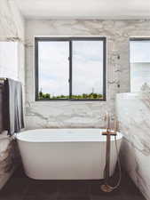 Bathroom featuring a soaking tub