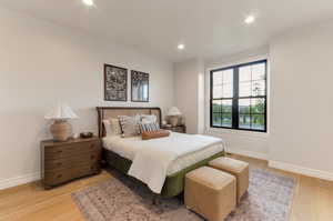 Bedroom featuring light wood-style flooring and recessed lighting