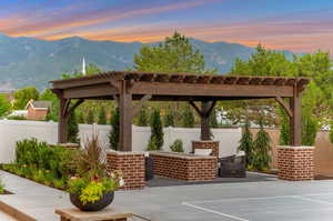 Fenced backyard with a mountain view and a patio area