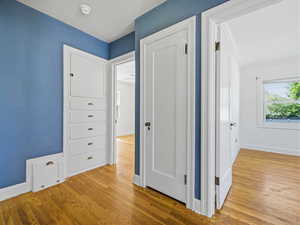 Hall featuring baseboards and light wood-style flooring