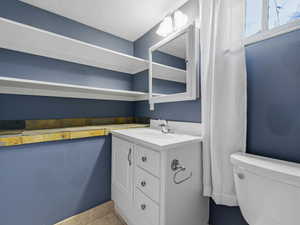 Bathroom featuring vanity and a textured ceiling