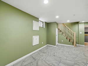 Basement featuring recessed lighting