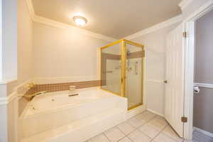 Primary bathroom with separate tub, shower and water closet.