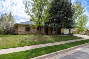 East Layton all brick rambler on wooded lot with views.
