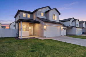 View of front of home with a gate, covered porch, an attached garage, and concrete driveway