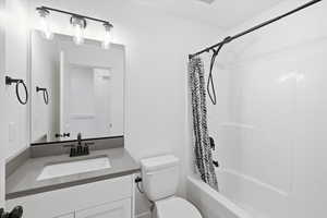 Full bathroom with vanity and shower / tub combo