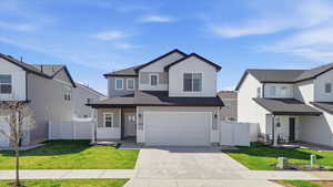 View of front of home featuring concrete driveway, an attached garage, a shingled roof, a gate, and a residential view
